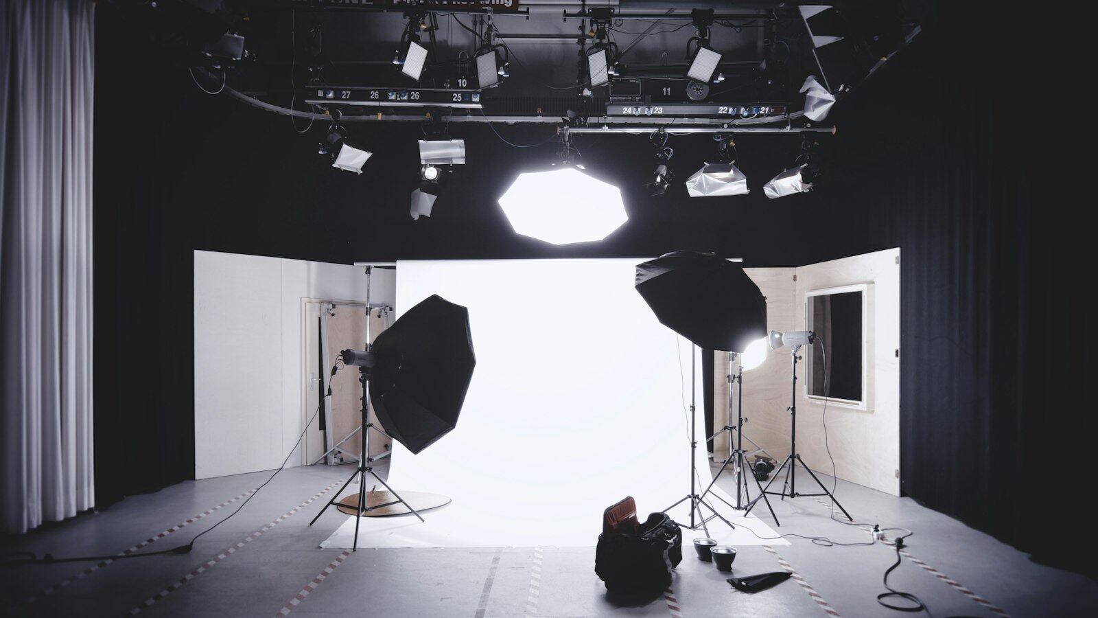 A professional production studio with lights and backdrop set up for a shoot